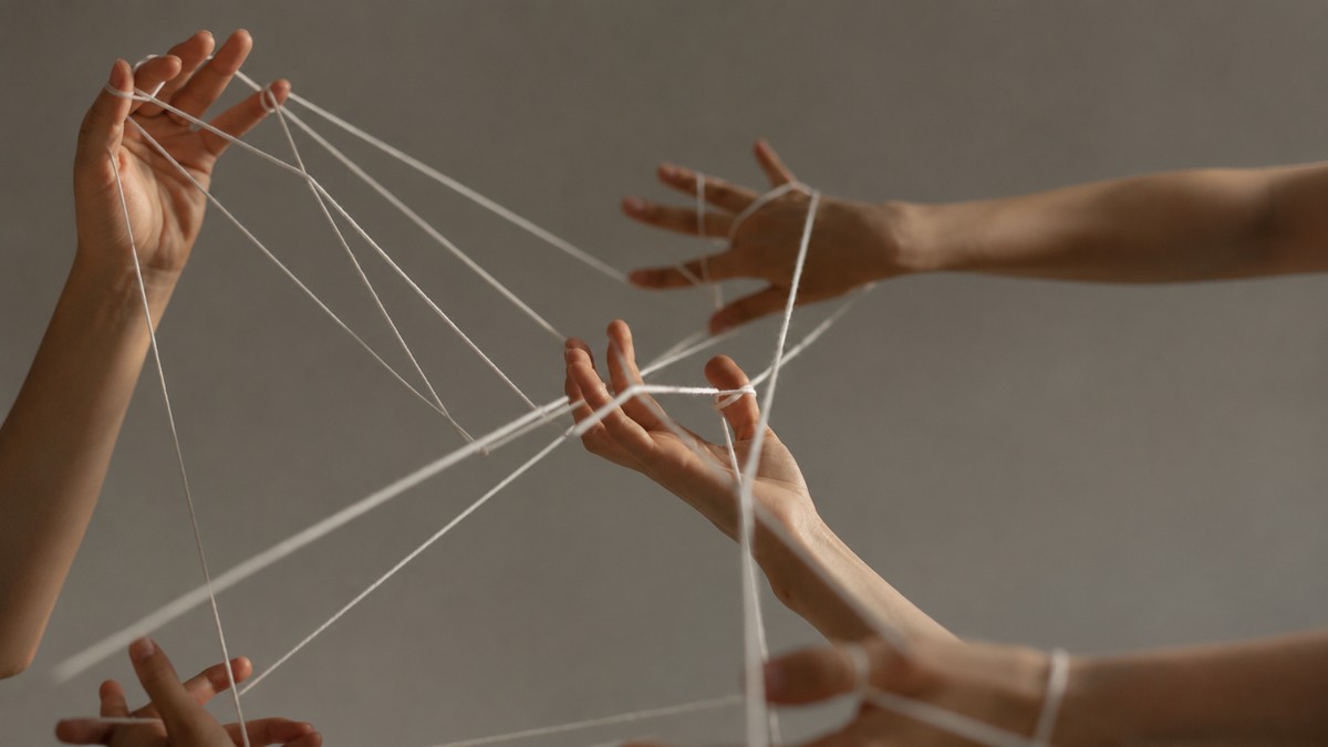 Two figures connected by a taut string, representing the hidden tension of unspoken words