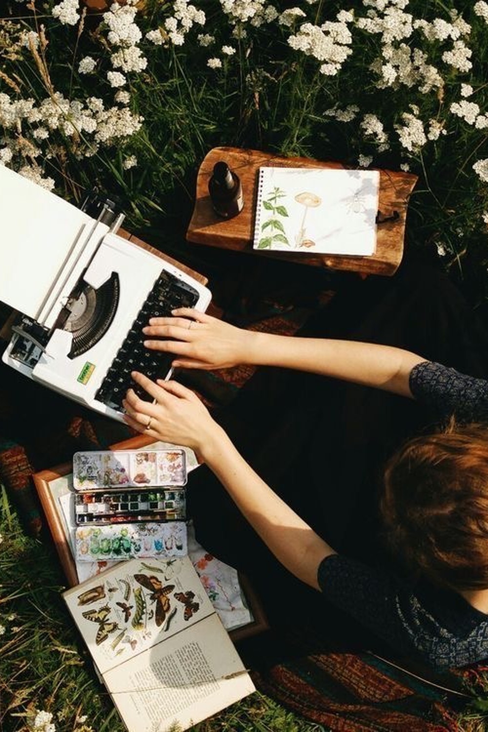 Vintage record player beside flowers, representing quiet effort that goes unnoticed